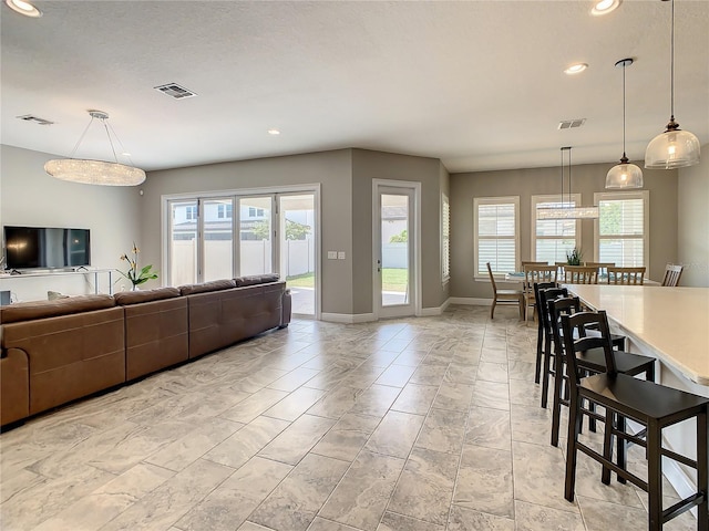 8491 Pippen Dr, Orlando, FL 32836 - living room featuring recessed lighting and baseboards