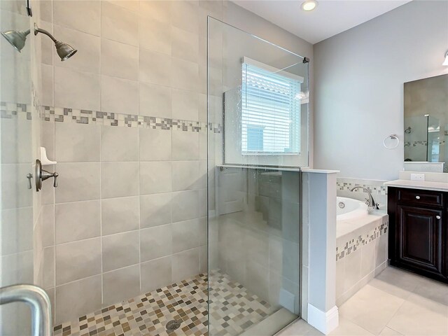 8491 Pippen Dr, Orlando, FL 32836 - bathroom with a garden tub, a stall shower, vanity, and recessed lighting