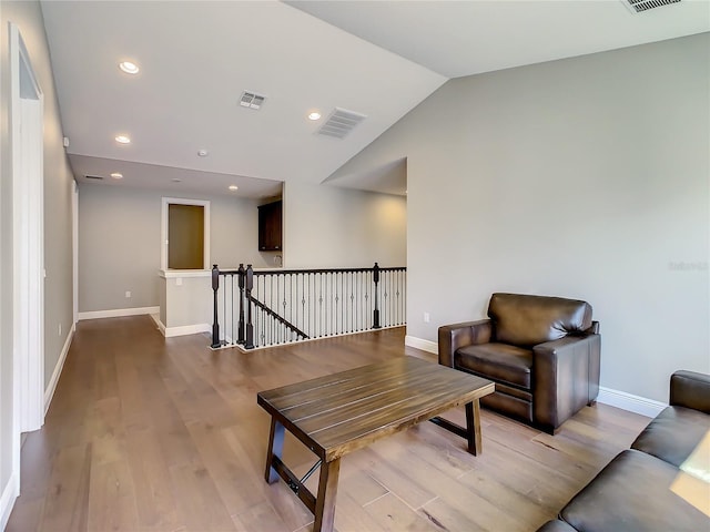 8491 Pippen Dr, Orlando, FL 32836 - sitting room with an upstairs landing, wood finished floors, baseboards, vaulted ceiling, and recessed lighting