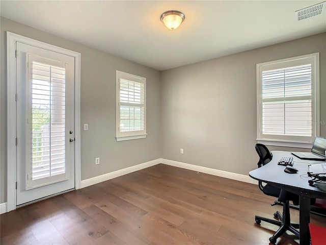 8491 Pippen Dr, Orlando, FL 32836 - unfurnished office with baseboards and dark wood-style flooring