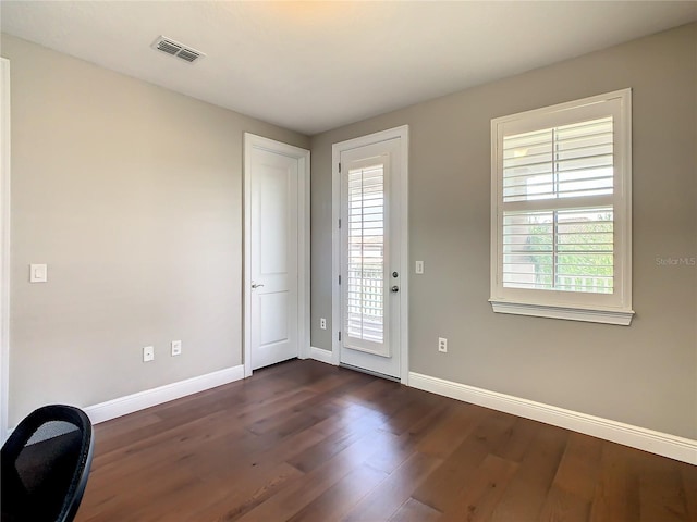 8491 Pippen Dr, Orlando, FL 32836 - foyer featuring baseboards and dark wood-style floors