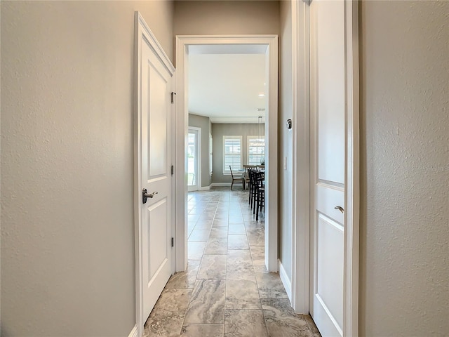 8491 Pippen Dr, Orlando, FL 32836 - hall featuring a textured wall and baseboards