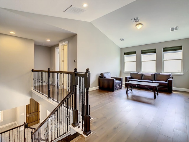 8491 Pippen Dr, Orlando, FL 32836 - hall featuring an upstairs landing, vaulted ceiling, wood finished floors, baseboards, and recessed lighting