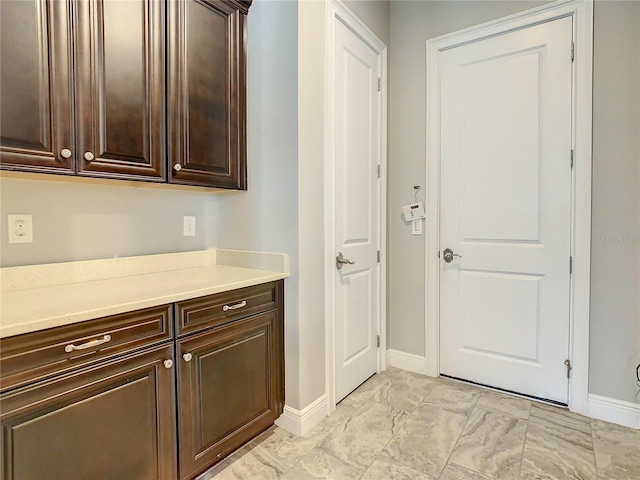 8491 Pippen Dr, Orlando, FL 32836 - interior space featuring baseboards and light marble finish floors