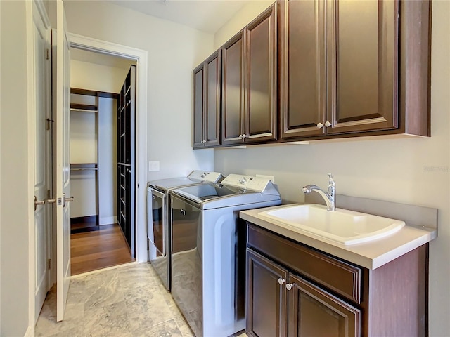 8491 Pippen Dr, Orlando, FL 32836 - clothes washing area with cabinet space and washing machine and dryer