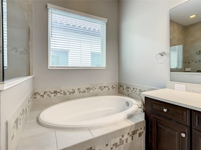 8491 Pippen Dr, Orlando, FL 32836 - full bathroom featuring a bath, vanity, and a tile shower
