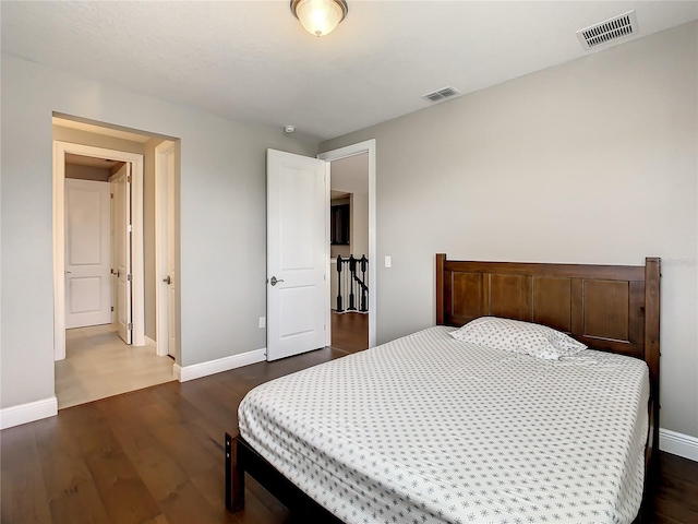 8491 Pippen Dr, Orlando, FL 32836 - bedroom with baseboards and dark wood-type flooring
