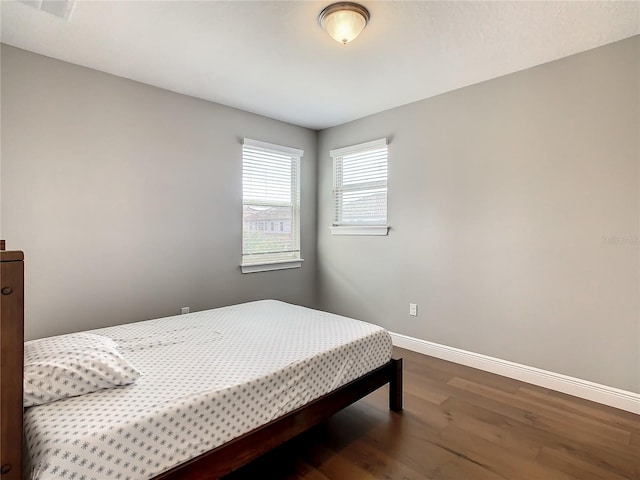 8491 Pippen Dr, Orlando, FL 32836 - bedroom featuring wood finished floors and baseboards