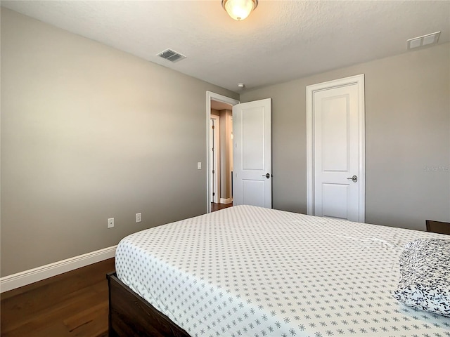 8491 Pippen Dr, Orlando, FL 32836 - bedroom with wood finished floors and baseboards