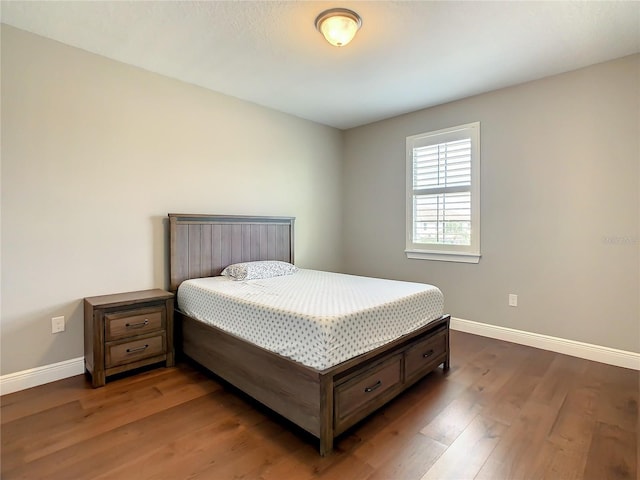 8491 Pippen Dr, Orlando, FL 32836 - bedroom with baseboards and dark wood-style floors