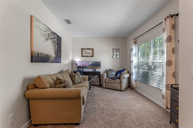 living area with carpet flooring and baseboards