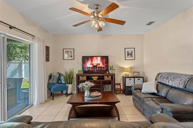 living room featuring light tile patterned flooring and a ceiling fan