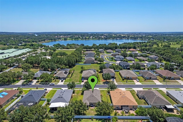 aerial perspective of suburban area featuring a nearby body of water