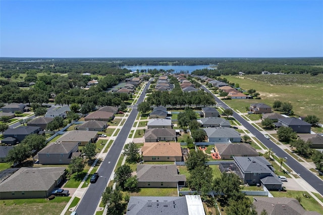 aerial view of residential area featuring a nearby body of water