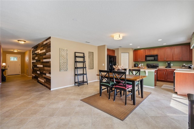 dining space with light tile patterned floors, baseboards, and recessed lighting