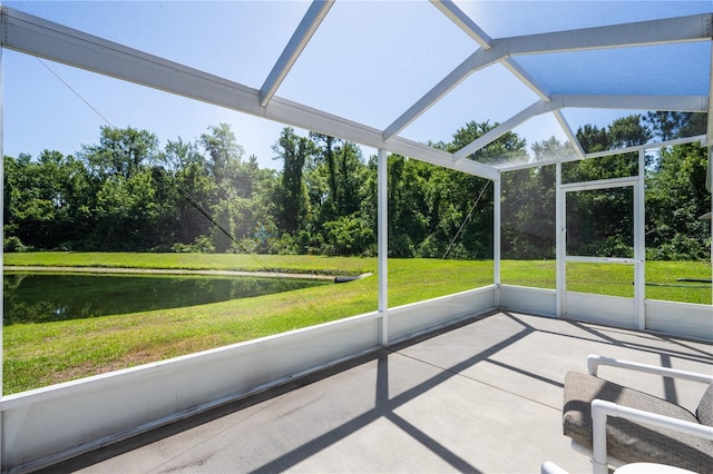 unfurnished sunroom featuring vaulted ceiling