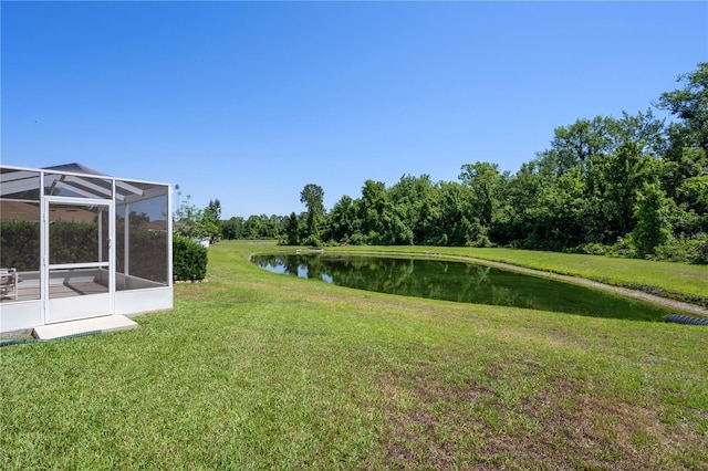 view of grassy yard with a water view