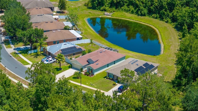 aerial view of residential area with a nearby body of water