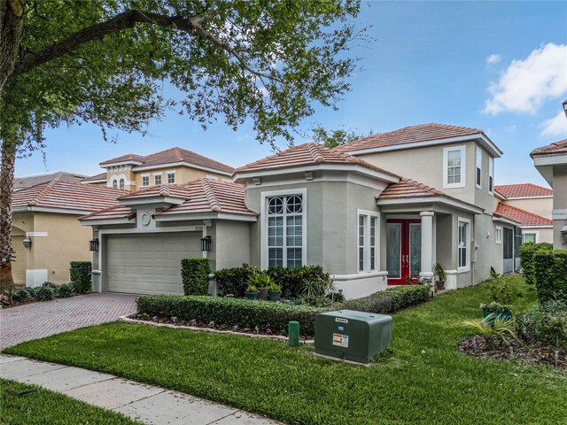 8333 Via Verona, Orlando, FL 32836 - mediterranean / spanish house with stucco siding, a tile roof, and decorative driveway