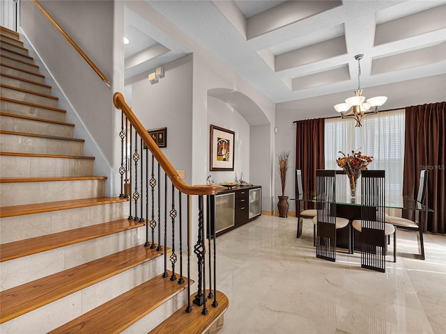 8333 Via Verona, Orlando, FL 32836 - stairway with coffered ceiling, arched walkways, a chandelier, marble finish flooring, and beam ceiling