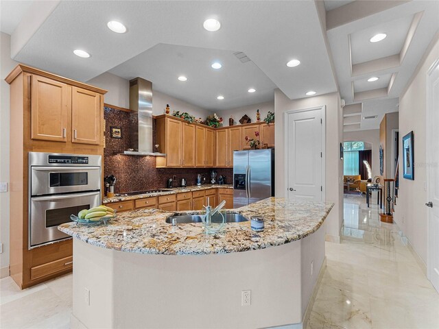 8333 Via Verona, Orlando, FL 32836 - kitchen with appliances with stainless steel finishes, wall chimney range hood, decorative backsplash, baseboards, and light stone countertops