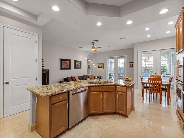 8333 Via Verona, Orlando, FL 32836 - kitchen with stainless steel appliances, french doors, brown cabinets, open floor plan, and recessed lighting