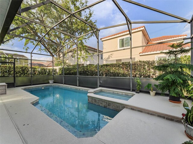 8333 Via Verona, Orlando, FL 32836 - view of pool featuring a patio, a lanai, and a pool with connected hot tub