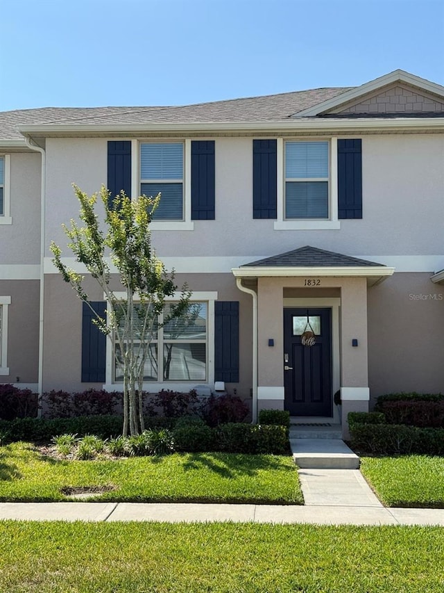 view of front of property featuring stucco siding