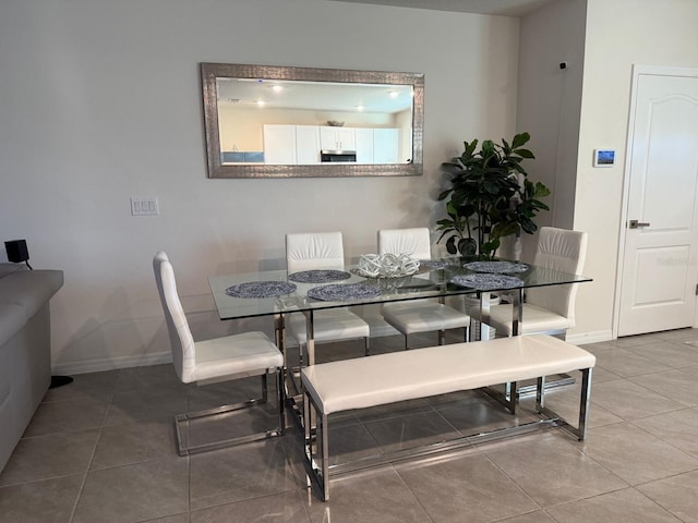 tiled dining area with baseboards