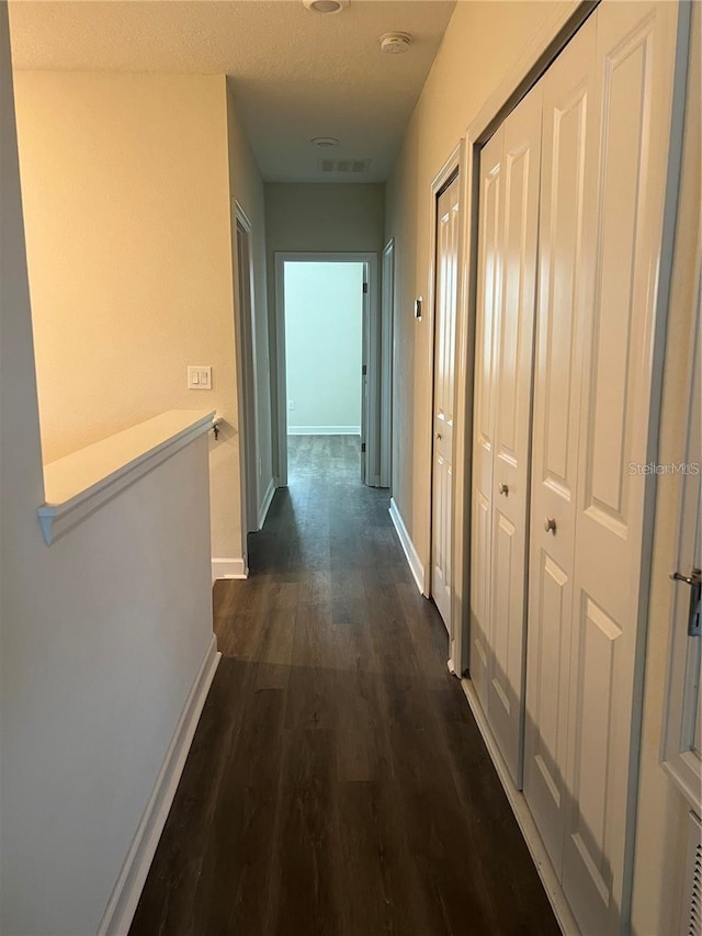 11258 Whistling Pine Way, Orlando, FL 32832 - hall featuring dark wood finished floors and baseboards