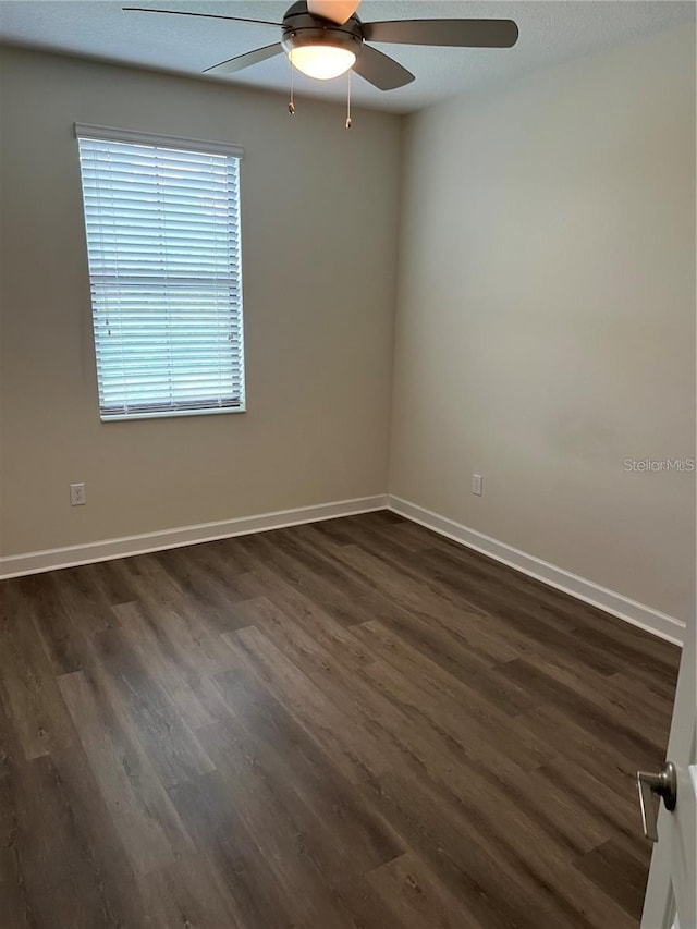 11258 Whistling Pine Way, Orlando, FL 32832 - unfurnished room featuring ceiling fan, dark wood-type flooring, and baseboards