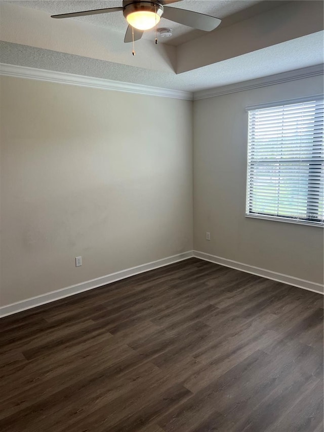 11258 Whistling Pine Way, Orlando, FL 32832 - empty room featuring ceiling fan, dark wood finished floors, crown molding, baseboards, and a textured ceiling