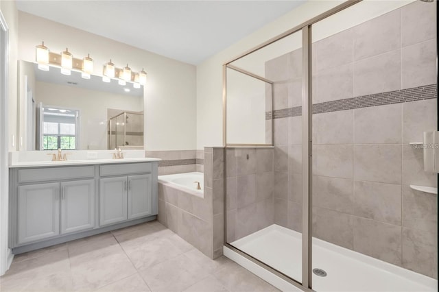 11258 Whistling Pine Way, Orlando, FL 32832 - full bathroom featuring a stall shower, tile patterned floors, a garden tub, and double vanity
