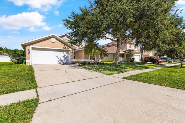 3078 Mandolin Dr, Kissimmee, FL 34744 - view of front of property with stucco siding, a front yard, driveway, and an attached garage