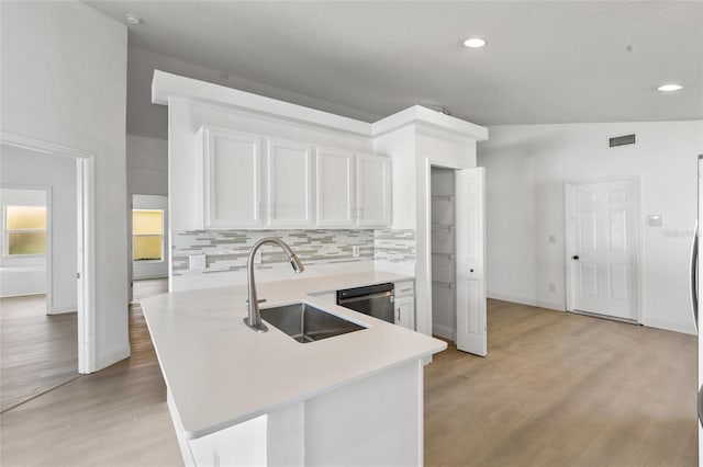 3078 Mandolin Dr, Kissimmee, FL 34744 - kitchen with a sink, dishwasher, light countertops, light wood finished floors, and recessed lighting