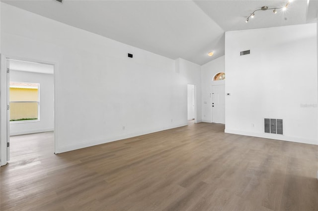 3078 Mandolin Dr, Kissimmee, FL 34744 - unfurnished room featuring wood finished floors, high vaulted ceiling, and baseboards