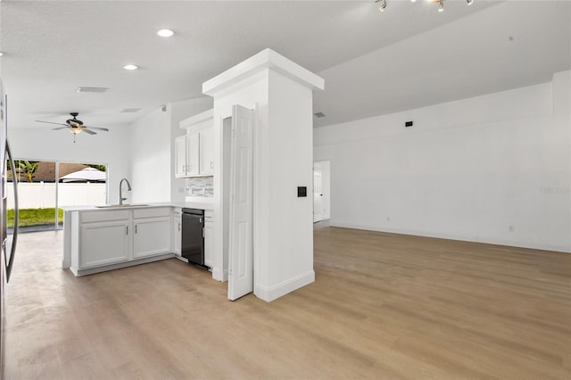 3078 Mandolin Dr, Kissimmee, FL 34744 - kitchen with open floor plan, a peninsula, a sink, black dishwasher, and a ceiling fan