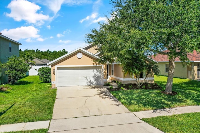3078 Mandolin Dr, Kissimmee, FL 34744 - view of front facade with stucco siding, a front yard, an attached garage, and driveway