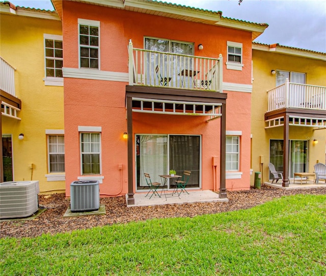 back of property featuring a balcony, central AC, and a patio area