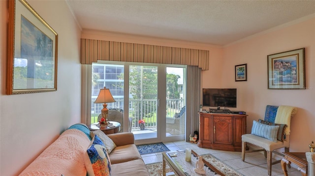 717 S Beach St Unit 205C, Daytona Beach, FL 32114 - living area featuring light tile patterned floors, a textured ceiling, and ornamental molding