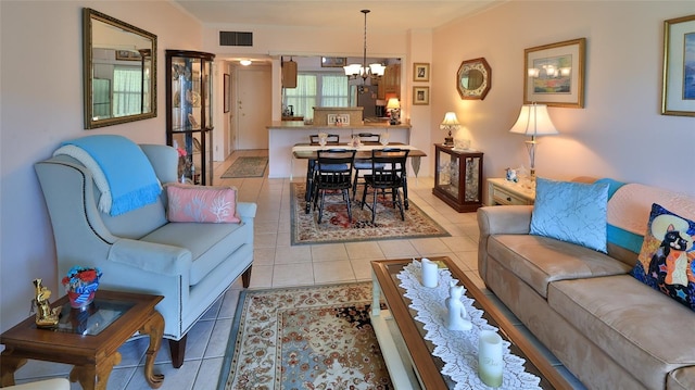 717 S Beach St Unit 205C, Daytona Beach, FL 32114 - living room featuring a chandelier and light tile patterned floors