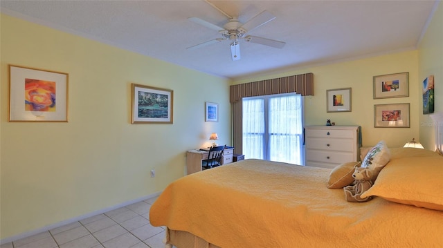 717 S Beach St Unit 205C, Daytona Beach, FL 32114 - bedroom with light tile patterned flooring, baseboards, and ceiling fan