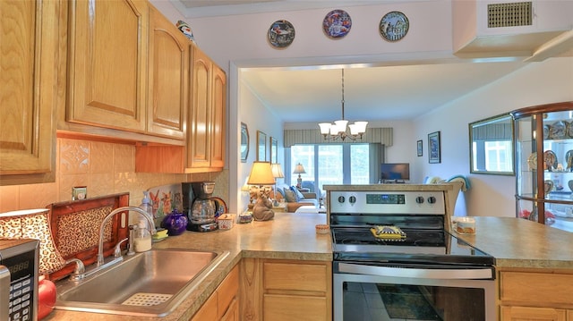 717 S Beach St Unit 205C, Daytona Beach, FL 32114 - kitchen with stainless steel range with electric stovetop, a sink, open floor plan, a chandelier, and light countertops