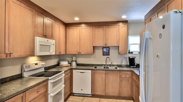 717 S Beach St Unit 205C, Daytona Beach, FL 32114 - kitchen featuring white appliances, a sink, dark countertops, recessed lighting, and light tile patterned flooring