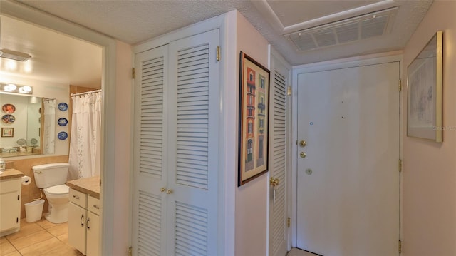 717 S Beach St Unit 205C, Daytona Beach, FL 32114 - hallway with light tile patterned floors