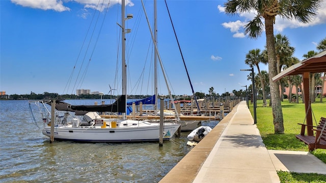 717 S Beach St Unit 205C, Daytona Beach, FL 32114 - dock area featuring a water view and a lawn