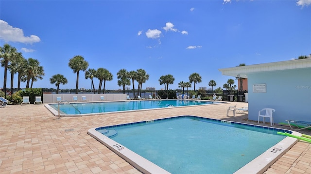 717 S Beach St Unit 205C, Daytona Beach, FL 32114 - community pool featuring a patio and fence