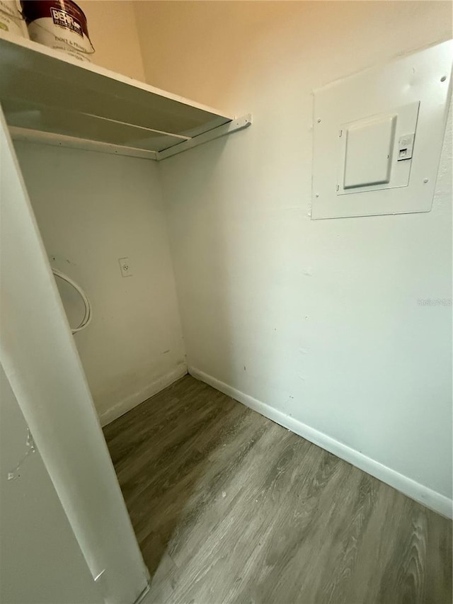 5540 Devonbriar Way Unit 103, Orlando, FL 32822 - walk in closet featuring electric panel and wood finished floors
