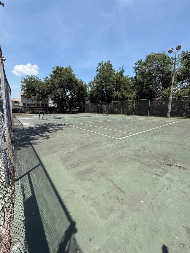 5540 Devonbriar Way Unit 103, Orlando, FL 32822 - view of tennis court with fence