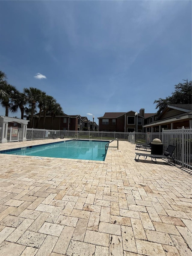 5540 Devonbriar Way Unit 103, Orlando, FL 32822 - community pool featuring a patio, fence, and a pergola